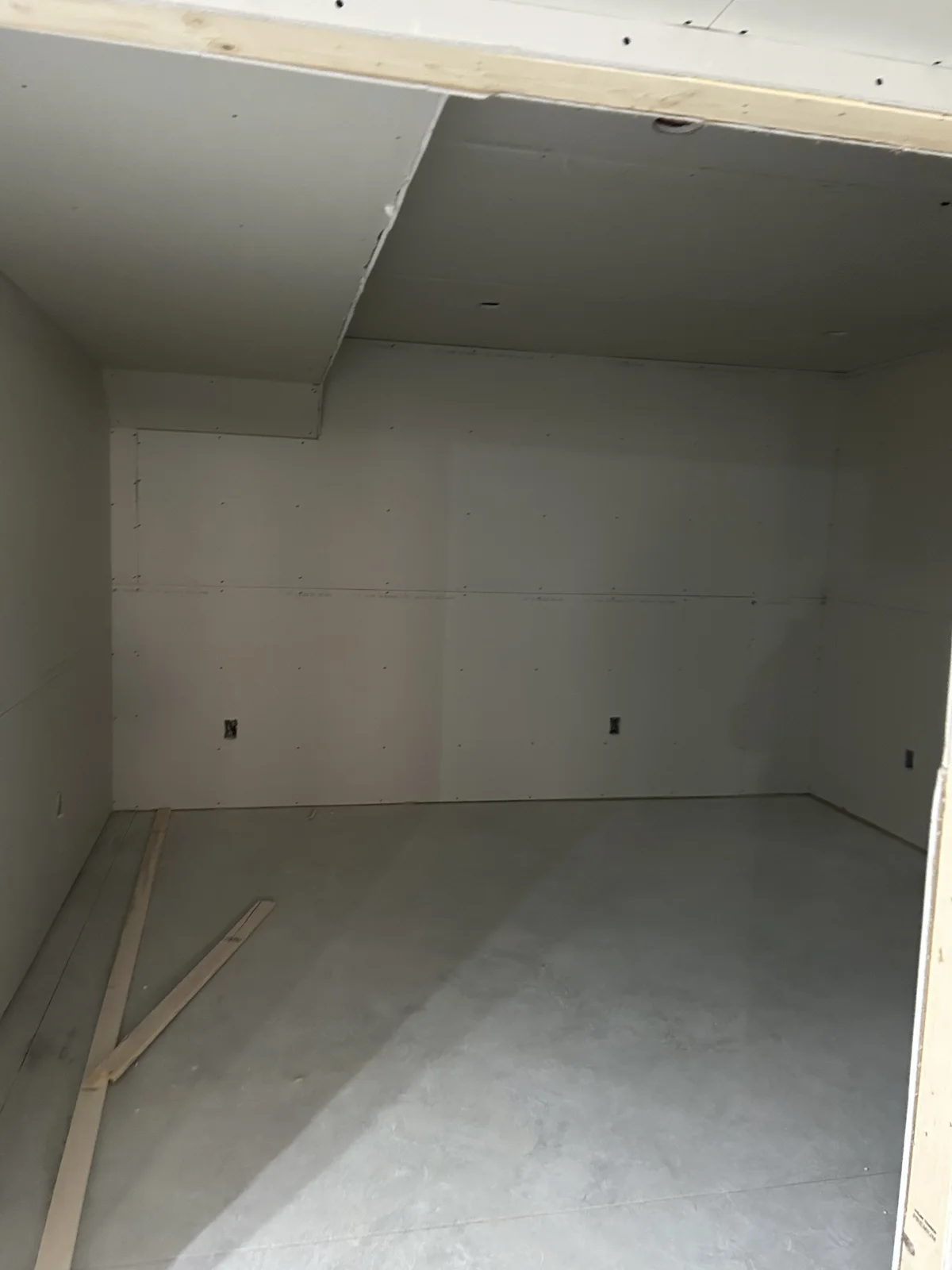 New Bedroom in the basement all hung with sheetrock!