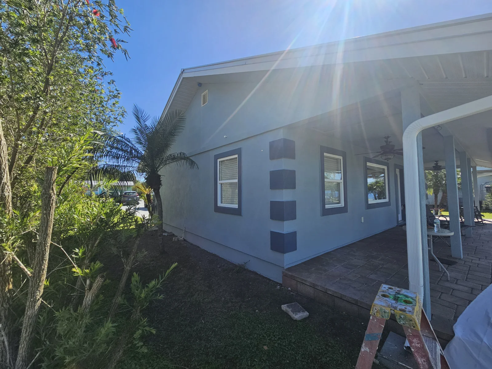 What a stunning paint job! That fresh coat of blue really is stunning next to the pretty palm tree in the yard! Exterior pressure washing and exterior painting by T&B Paint Pros LLC, serving Palm Coast, Daytona Beach, St. Augustine FL and surrounding areas.